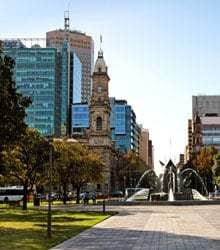 Building, trees and fountain.