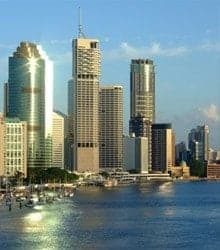 Buildings beside an ocean.