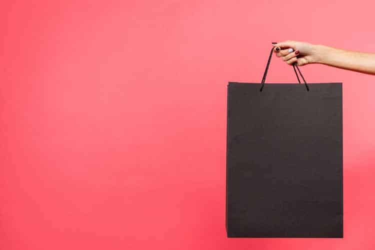 woman holding shopping bag