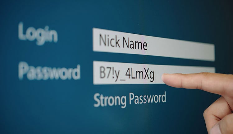 User entering password on computer